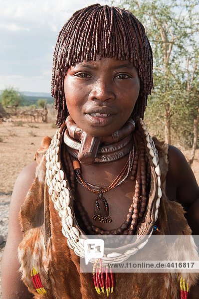 Young Hamar woman wearing necklaces made of Cowry shells  Omo river valley  Southern Ethiopia