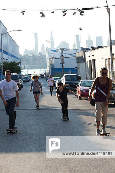 Skateboarders on urban street