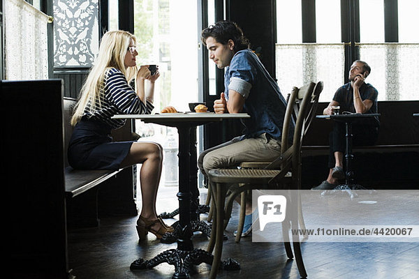 Couple having coffee in cafe