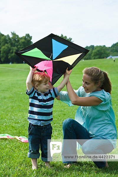Mother and son playing with kite
