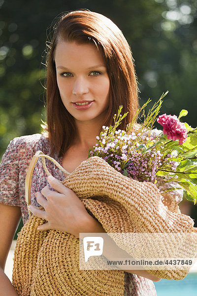 Young woman holding bouquet