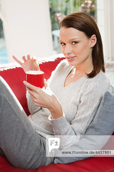 Young woman drinking coffee