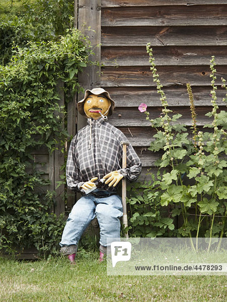 Sitting scarecrow