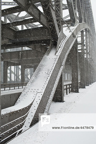 The metal structure of a road bridge in a snowstorm