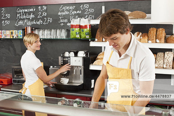 Two employees working in a bakery cafe