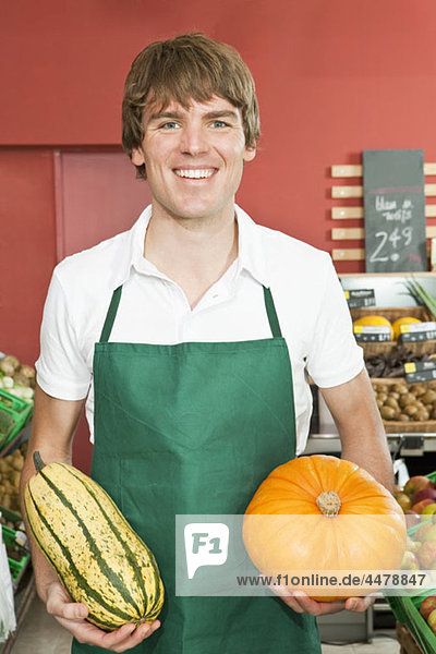 A stocker holding two varieties of winter squash