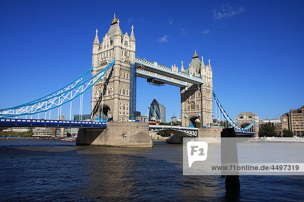 Great Britain  England  UK  United Kingdom  London  travel  tourism  bridge  landmark  Tower Bridge  Thames  river  flow  boat  Swiss Re  gherkin