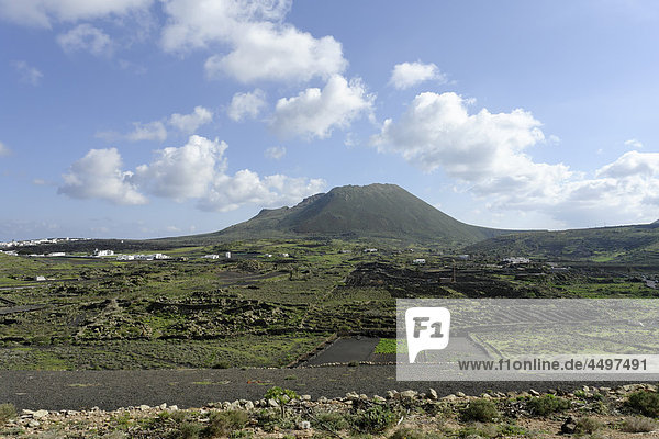 Spain Lanzarote Reading Rositas volcano Monte Corona plants mountains fields gardens buildings constructions scenery panorama volcanoes