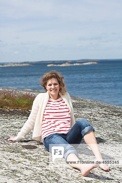 Portrait of woman sitting on beach