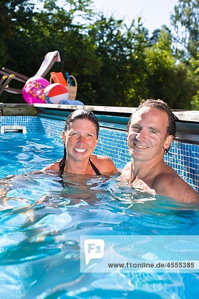 Portrait of couple in swimming pool