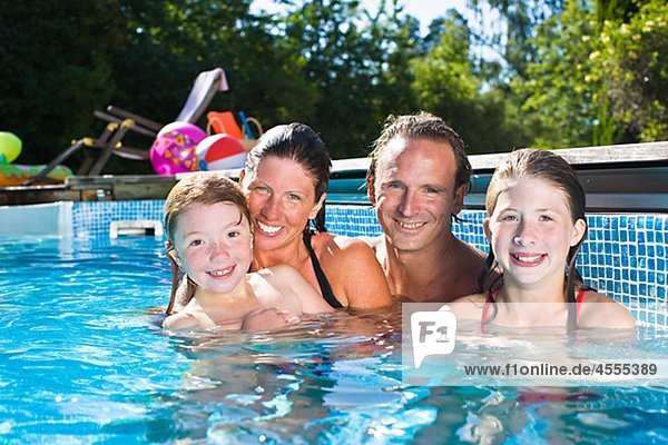 Portrait of family in swimming pool