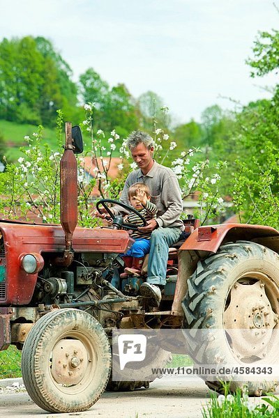 father with his child on tractor  Bosnia and Hercegovina