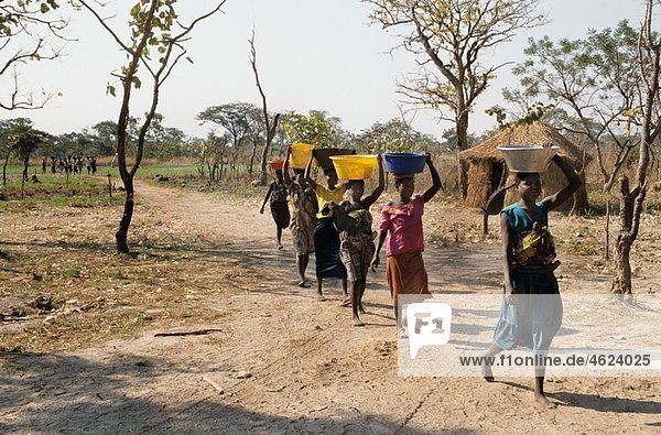 refugeecamp in Uganda Civil war has resulted in hundred of thousands of displaced people who have settled in makeshift houses Aid agencies provide water for drinking