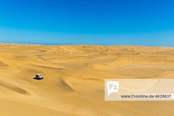 Africa,  Namibia,  4x4 vehicle in namib desert