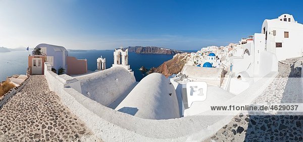Greece Cyclades Thira Santorini Oia View of blue dome and bell tower of a church with aegean sea