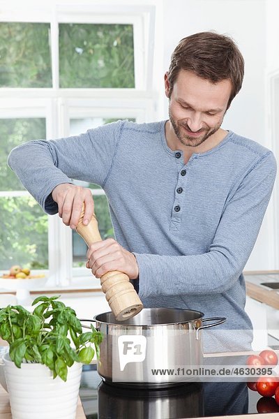 Man preparing meal  smiling