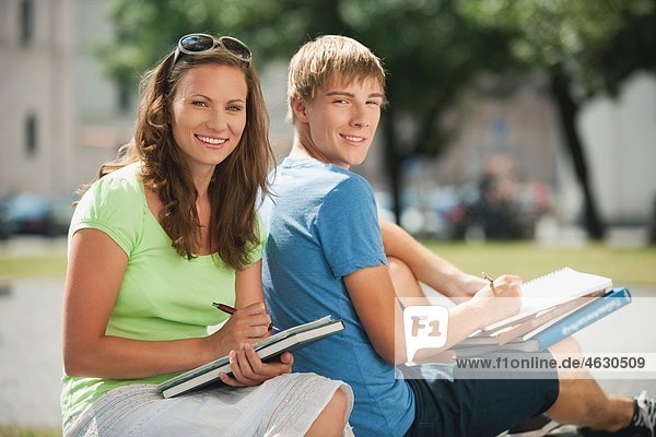 Young man and young woman in university  smiling  portrait