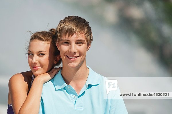Young man and woman smiling  portrait