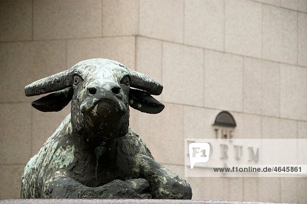 Statue of a bull in front of the Hong Kong Stock Exchange