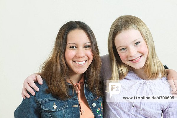 Studio portrait of two teenage friends.