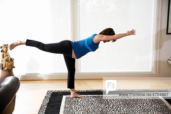 Pregnant woman practicing yoga