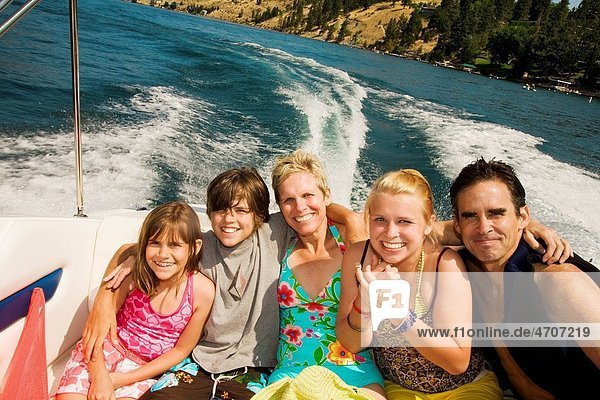 Family sitting in a motorboat