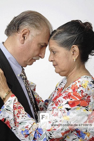 Old couple old woman touching forehead on old man concerned look MR 703B and 703A