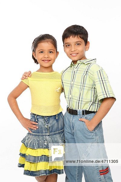 Brother and sister standing close to each other and smiling MR703N 703O