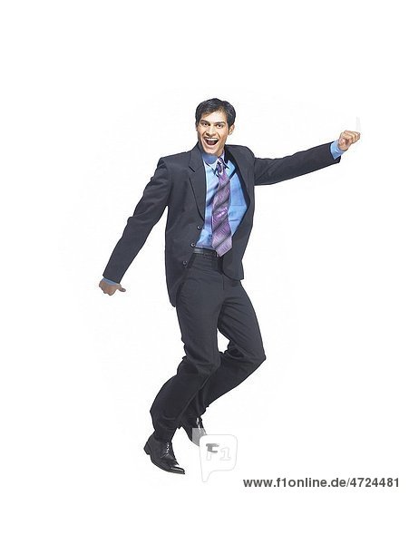 South Asian Indian executive man jumping with joy MR