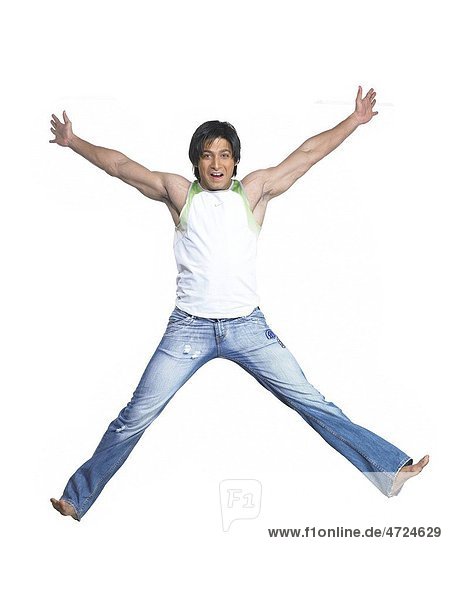 South Asian Indian man jumping with joy MR