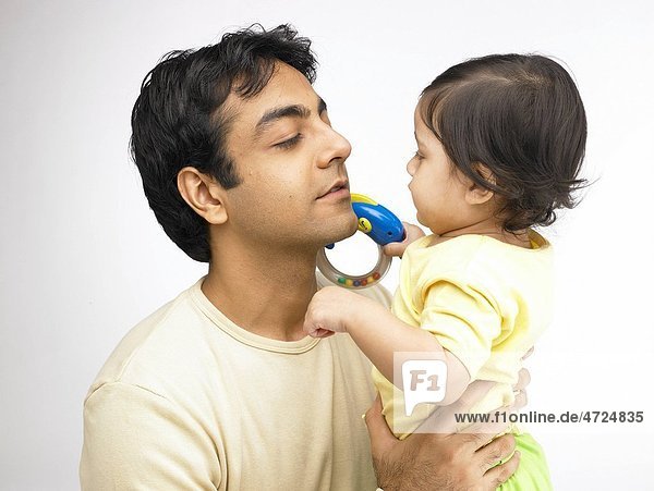 Indian father and baby girl looking at each other MR702O 702A