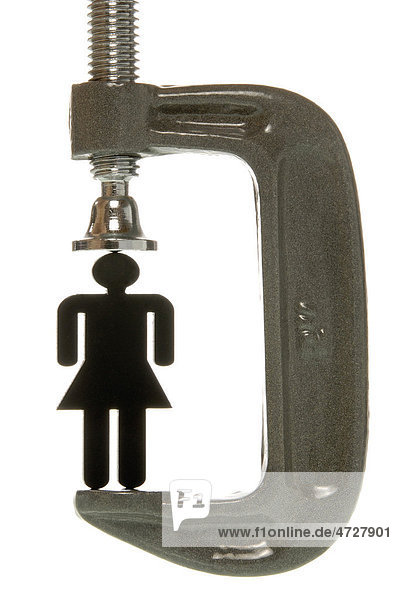 Kleine schwarze Frauenfigur in Schraubklemme  Symbolbild für Leistungsdruck