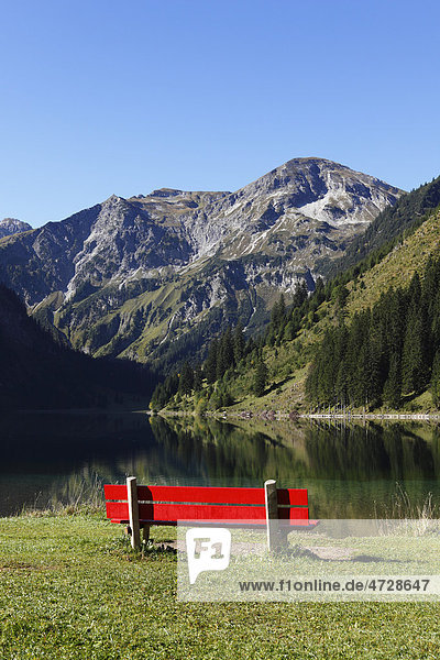 Red bench on Lake Vilsalpsee at Tannheim  Vilsalpseeberge mountains  Tannheimer Tal high valley  Tyrol  Austria  Europe