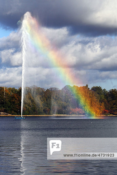 Alster Fountain  water fountain creating a rainbow on the Inner Alster Lake in the center of Hamburg  Germany  Europe