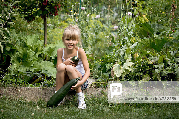 Young girl working in the garden