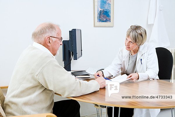 Doctor and patient talking in clinic