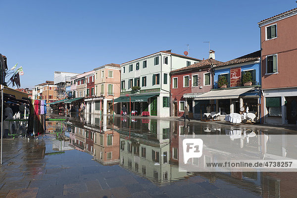 Winter Floods Aqua Alta Flooding The Main Shopping Street Houses Are Reflected In The Water Burano Island Venice Italy Southern Europe