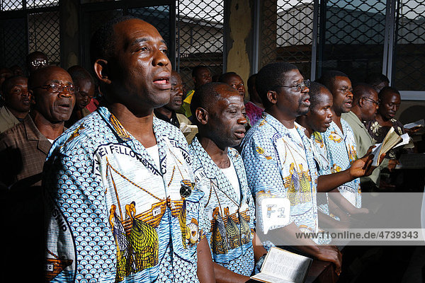Men singing at the Sunday service  Bamenda  Cameroon  Africa