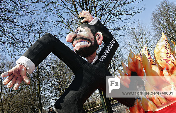 Iranian President Ahmadinejad in the form of a swastika  paper-mache figure  satirical themed parade float at the Rosenmontagszug Carnival Parade 2011  Duesseldorf  North Rhine-Westphalia  Germany  Europe