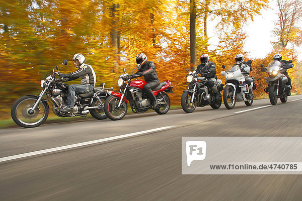 Group of motorcyclists  in motion