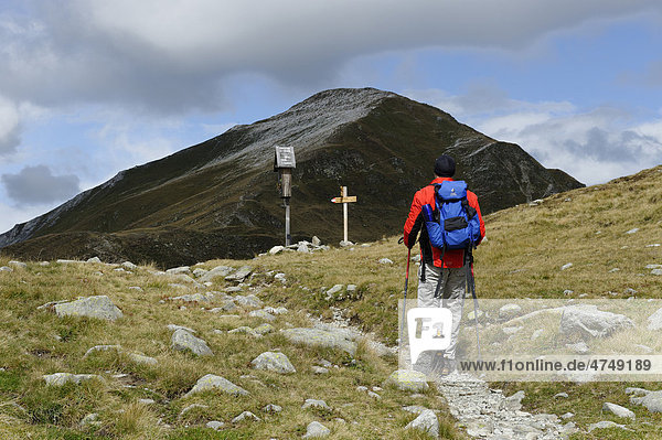 Mountaineer  Hiker  at Mt Zinseler  Sarntal Alps at Penser Joch mountain pass  near Sterzing  South Tyrol  Italy  Europe