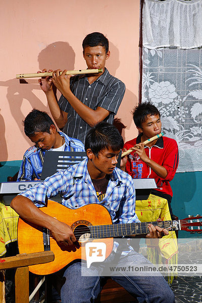 Students making music  boarding school  Simalungun  Sumatra  Indonesia  Asia