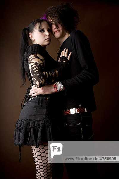 Standing couple hugging each other  Goth subculture  Emo