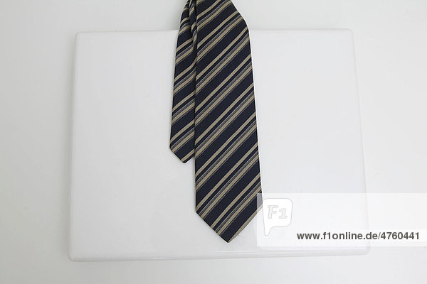 Laptop with a tie  working in the office