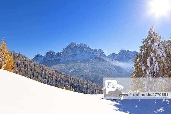 Haystack in snowy mountain landscape Sexten Alto Adige Italy