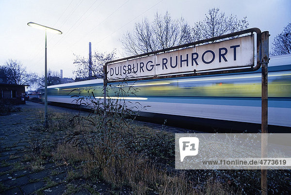 Overgrown platform train passing Duisburg-Ruhrort suburban train station North Rhine-Westphalia Germany Europe