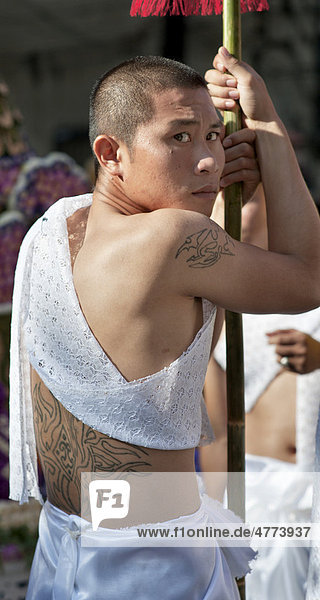 Tattooed young man taking part in the annual Flower Festival  Chiang Mai  Thailand  Asia