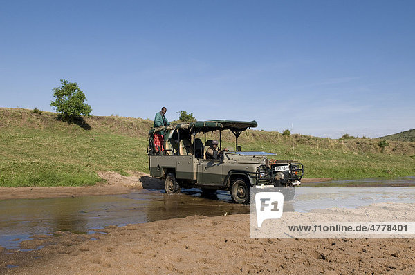 Jeep during a safari  Masai Mara National Reserve  Kenya  Africa