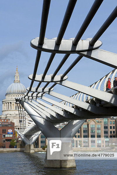 Pedestrians crossing Millennium Bridge over the River Thames  St. Paul's Cathedral  London  England  United Kingdom  Europe
