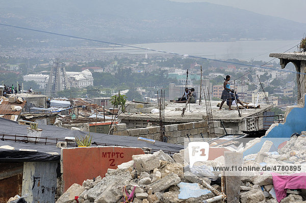 Rubble in the slums of Fort National  the district was largely destroyed by the earthquake in January 2010  in the back left the destroyed presidential palace  Port-au-Prince  Haiti  Caribbean  Central America